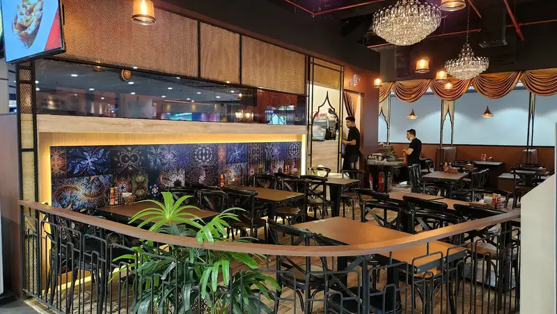 Dining area with chandeliers and lattice railing
